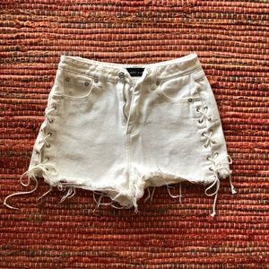 White denim shorts with shoes lace ties